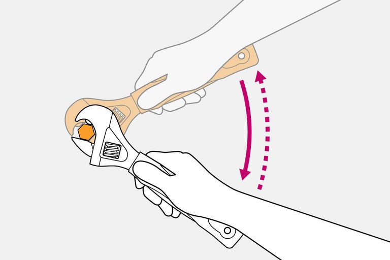 Justerbar skiftnyckel som drar åt en skruv
