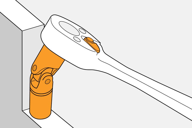 Hylsnyckel med led används i ett hörn