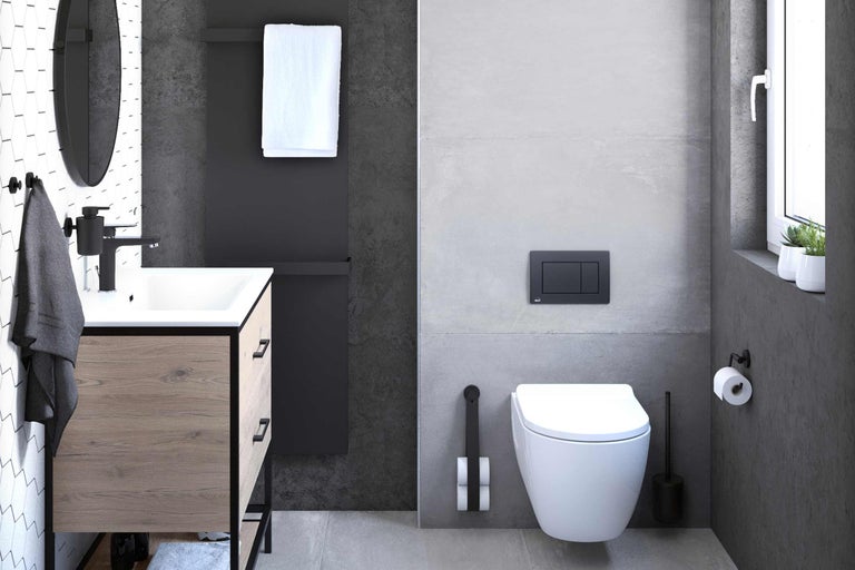 Modernt badrum med handfat, toalett och radiator