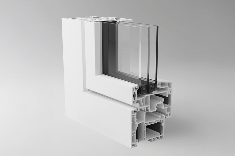 Tvärsnitt av ett vitt plastfönster med treglas