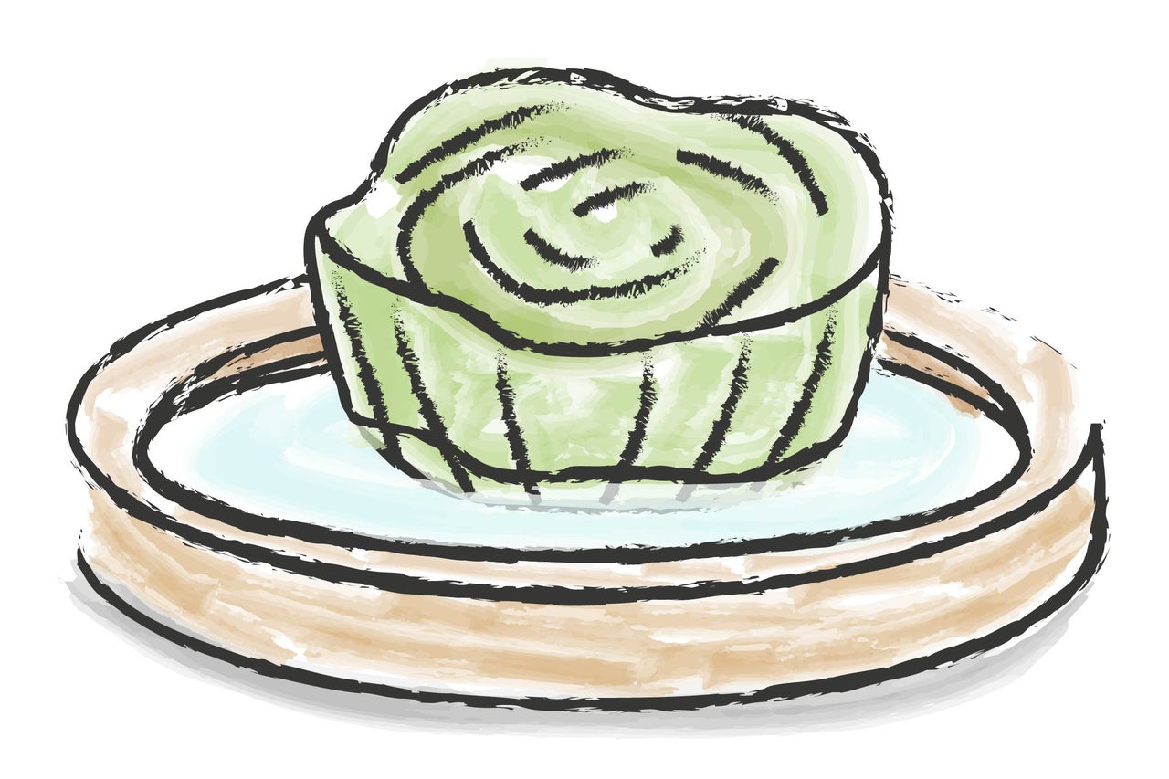 Illustration av en grön tårta på en tallrik