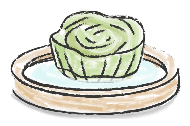 Illustration av en grön tårta på en tallrik