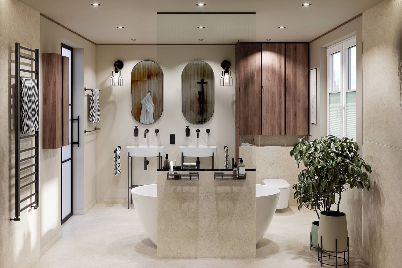 Modernt badrum med dubbelt tvättställ, ovala speglar, fristående badkar, träskåp och handdukstork.