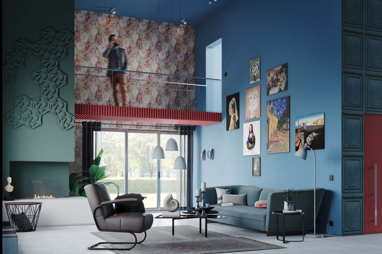 Vardagsrum med soffa, fåtölj, soffbord och konst på väggarna