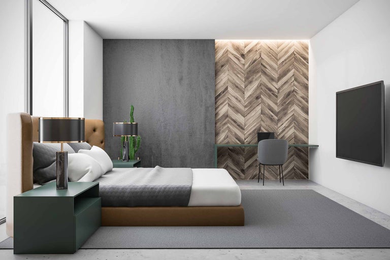 Sovrum med säng, skrivbord och tv på väggen