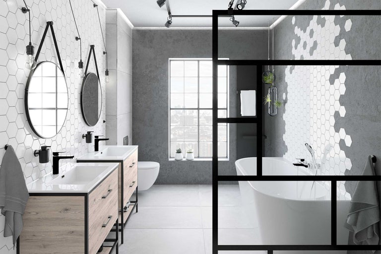 Badrum med dubbla handfat, fristående badkar och hexagonala plattor