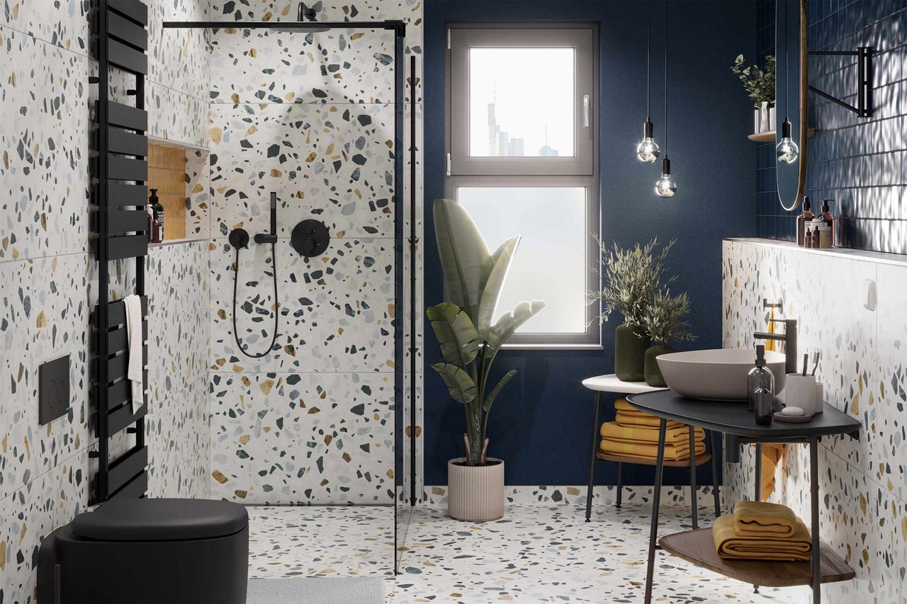 Modernt badrum med terrazzogolv och -väggar, dusch, toalett och handfat