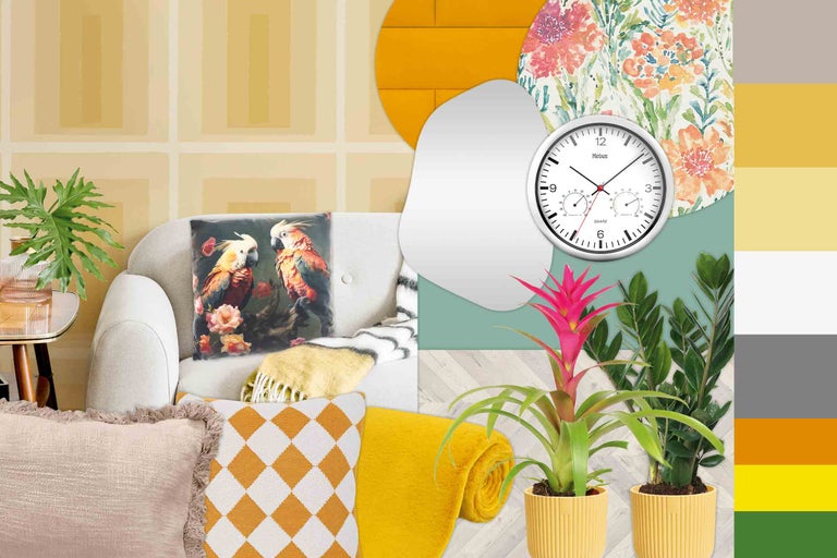 Dekorativt vardagsrum med soffa, kuddar, filtar, matta, klocka och krukväxter