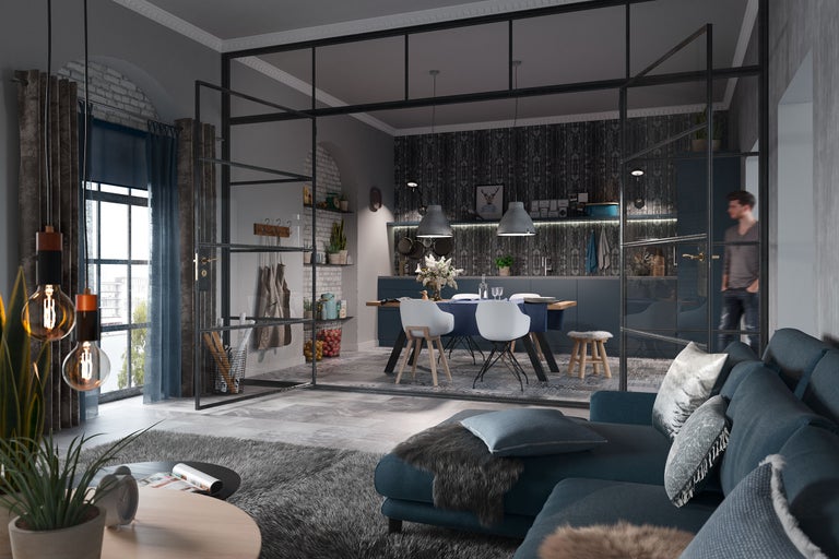 Vardagsrum med soffa, bord och stolar bakom en skiljevägg