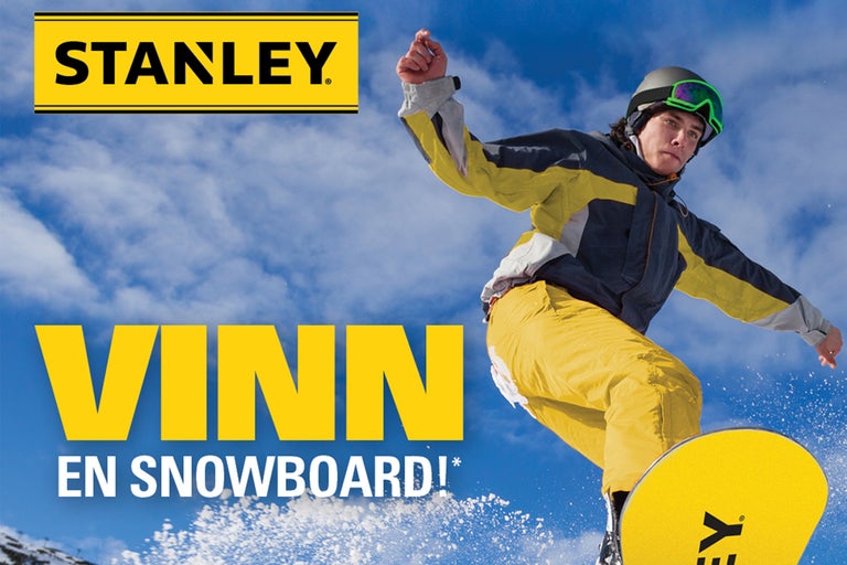 Stanley Logo. Snowboardåkare på snö framför blå himmel.