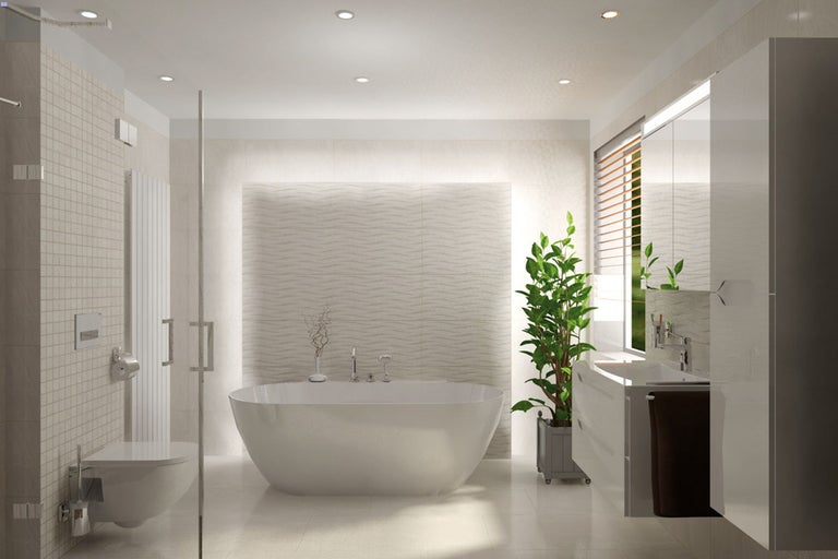 Ljust badrum med fristående badkar, tvättställsskåp och duschkabin