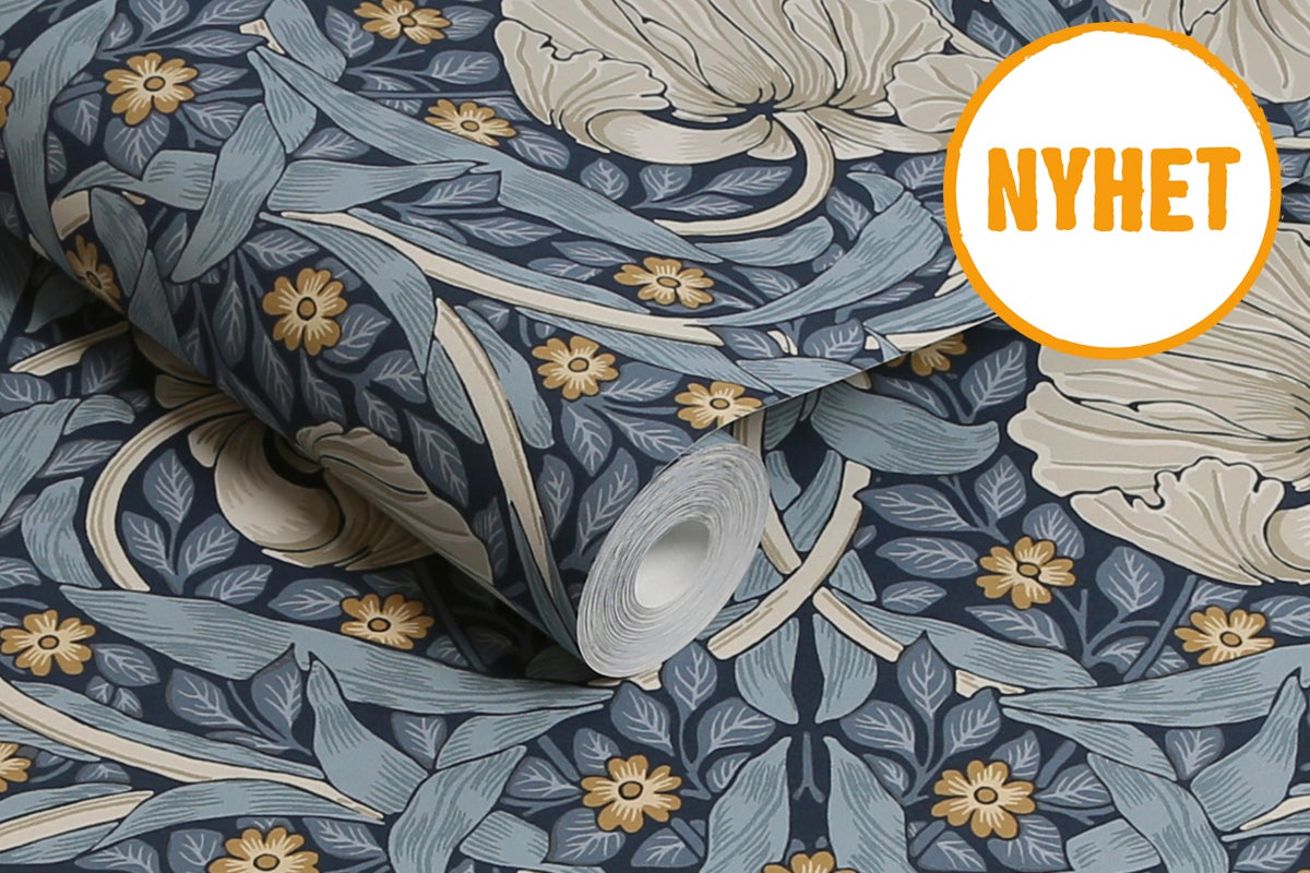 Tapetrulle med blommotiv och ordet Nyhet