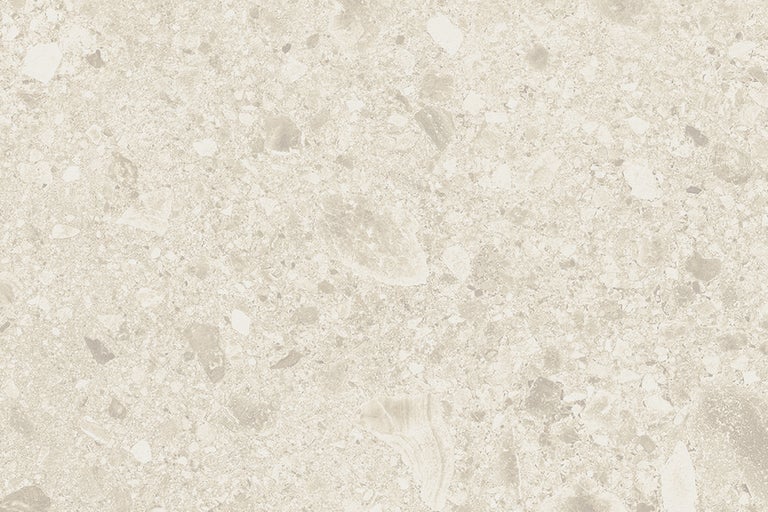 Närbild av en golvplatta med en spräcklig yta.