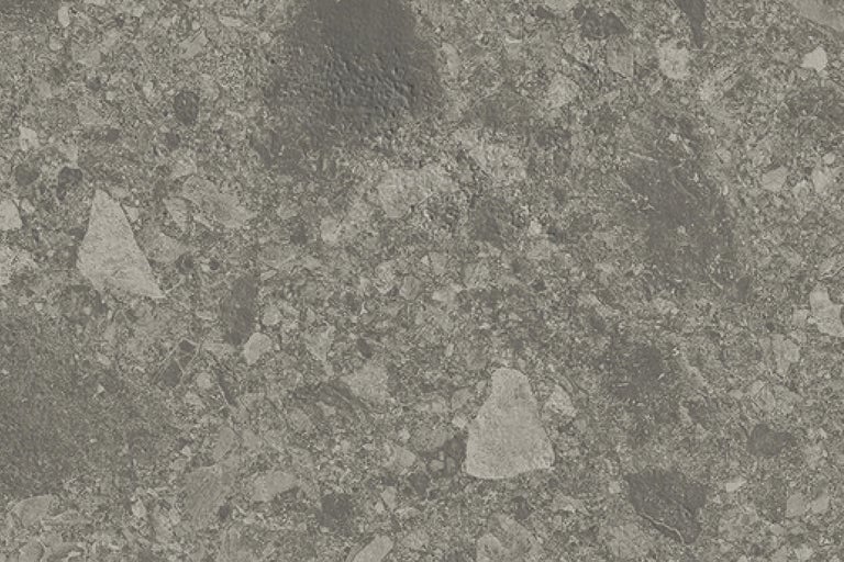 Närbild av en golvplatta med stendekor.