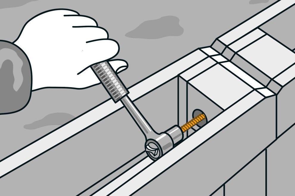 Illustration av en hand som drar åt en skruv med en skiftnyckel