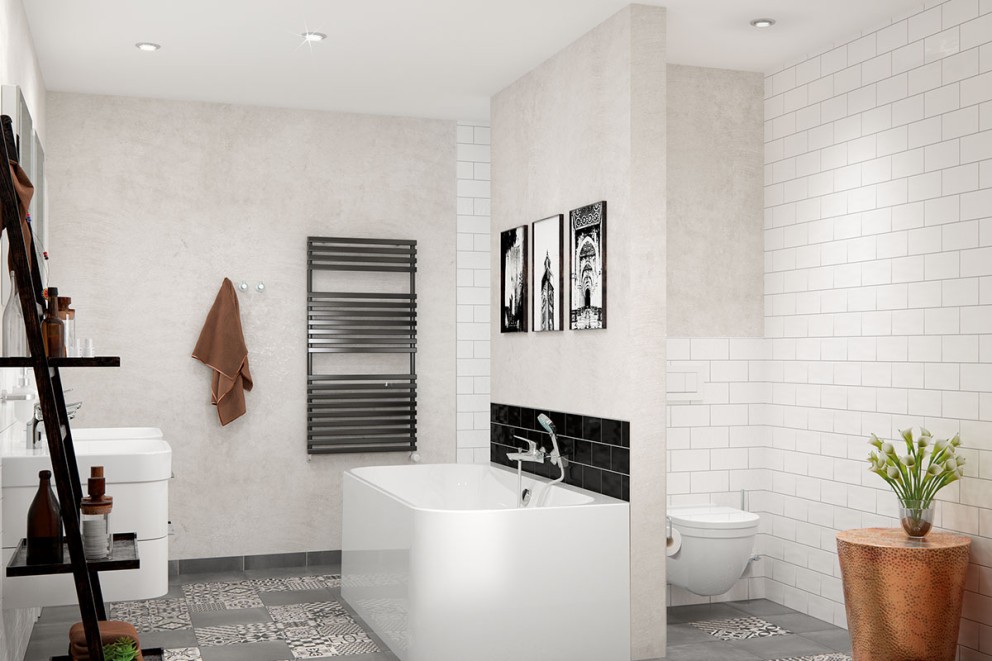 Ljust badrum med badkar, handfat, radiator, toalett och dekorativa element.