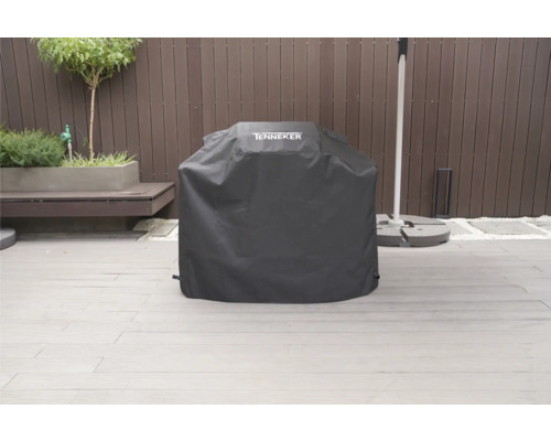 Tenneker grillöverdrag för att skydda en grill utomhus.