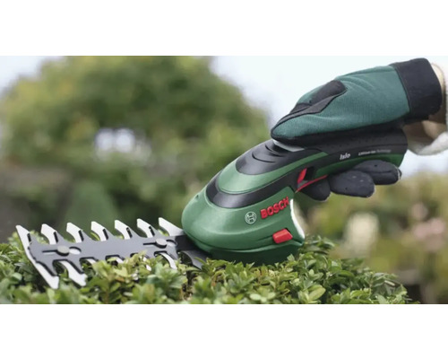 Batteridriven sax för att klippa häckar med handskar