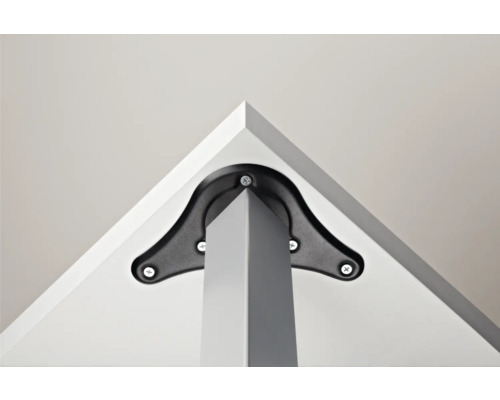 Detaljvy av en bordsbensfäste med skruvar på en bordsskiva