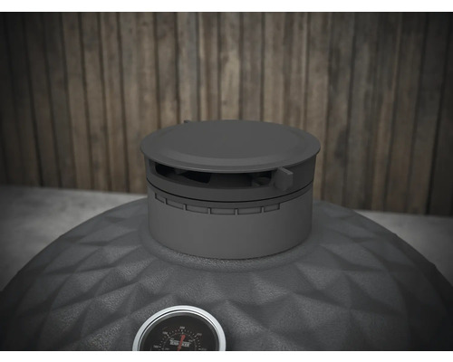 Övervy av en kolgrill med temperaturdisplay.