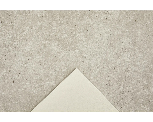 Närbild av en betonggolvplatta med prickig textur