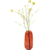 Dekorativa konstgjorda blommor i glasvas