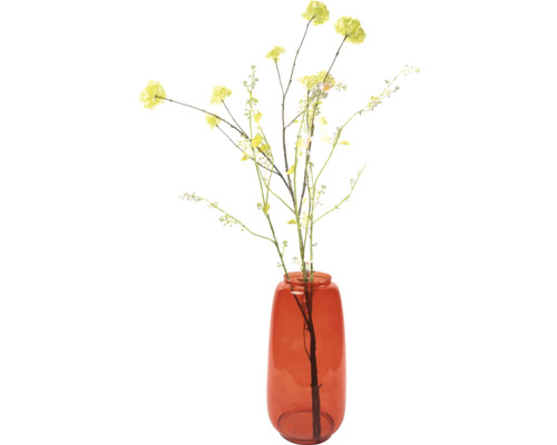 Dekorativa konstgjorda blommor i glasvas