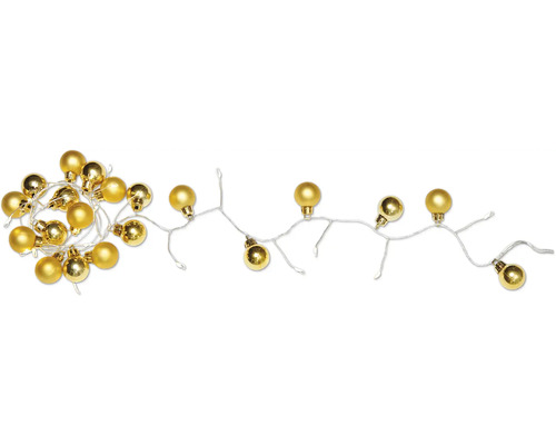 Gyllene ljusslinga med kulor för dekoration