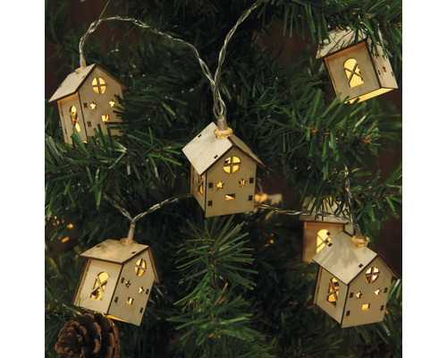 Ljusslinga med husmotiv på en julgran