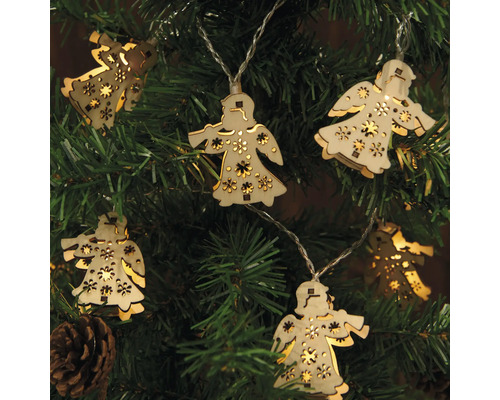 Ljusslinga med ängelmotiv av trä på en julgran