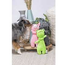 Hund med gosedjur groda, gris och koala på ett litet bord