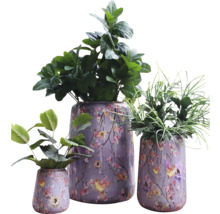 Tre planterade ytterkrukor med blommönster