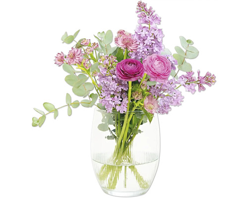 Blombukett med ranunkel och syren i en glasvas