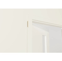 Detalj av en vit dörrkarm med ett dörrblad i bakgrunden