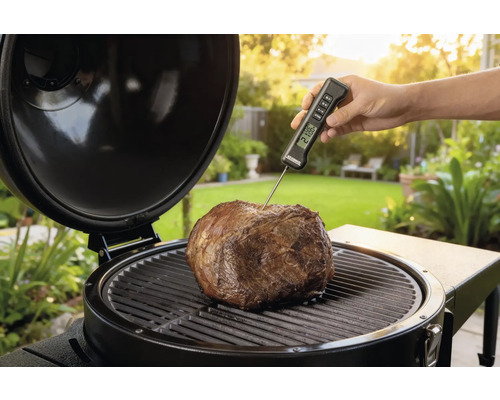 Stek på grill med termometer för temperaturkontroll