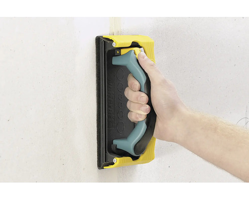 Hand med slipegig för slipning av en vägg