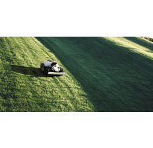 Robotgräsklippare i drift på en gräsmatta