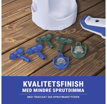 Färgsprutmunstycken och tillbehör för färgsprututrustning på ett träbord