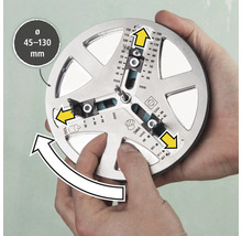 Ett verktyg för exakt markering av borrhål med en diameter på 45 till 130 millimeter hålls av två händer.
