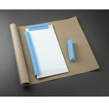 Förpackningsmaterial: glasplatta, pappersrulle, wellpapp och skumskydd.