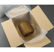 Brun glasvas i en kartong med bubbelplast