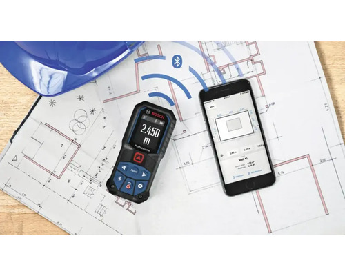 Bosch laseravståndsmätare med Bluetooth-anslutning till en smartphone-app på en ritning.