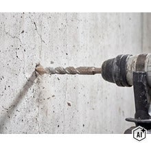 En slagborrmaskin borrar ett hål i en betongvägg med betongpartiklar som flyger. (Image AI modified or generated)