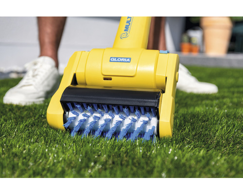 Gloria logotyp. Gloria elektrisk fogborste på gräsmatta.
