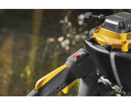 Detaljbild av trimmer med strömbrytare och handtag