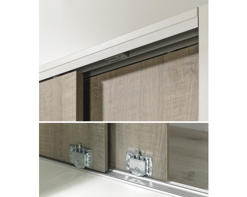 Detaljvy av en skjutdörrsgarderob med fokus på skjutdörrsmekanismen