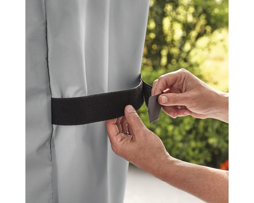 Fästning av en grå markis med kardborreband