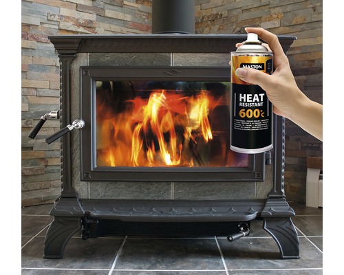 Bilden visar en kamin och en sprayburk med värmebeständig spray 600 grader.