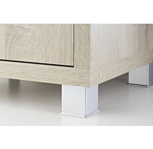 Detaljvy av en möbel med trästruktur och fyrkantiga metallben