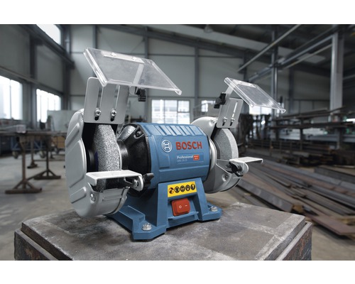 Dubbelslipmaskin från Bosch med skyddsanordningar och arbetsstyckesstöd